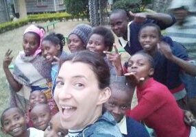 Many of the girls who board in the Don Bosco school plus the on-campus “moms” pose for a selfie.