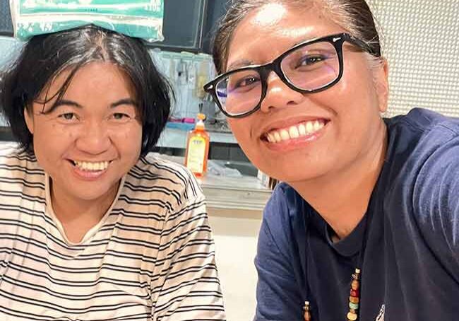 Sister Jessica and others being silly with tissue paper.