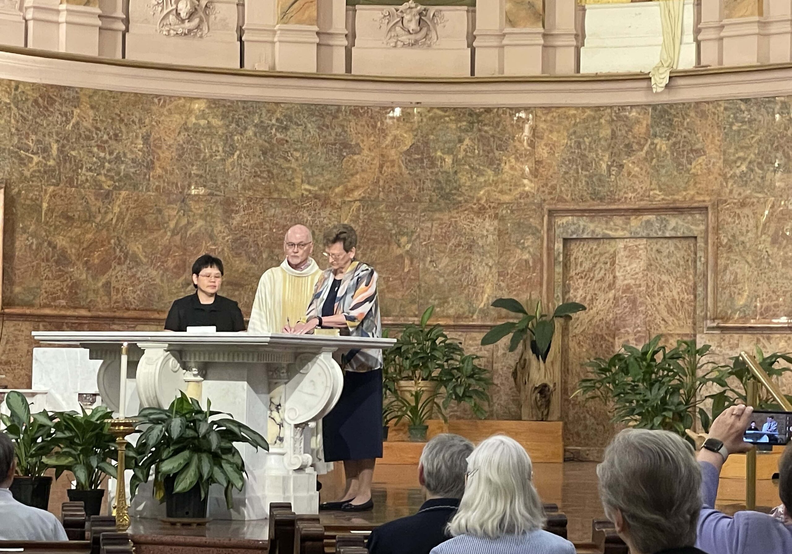 Sister Leslie Dao (from left), Father Terry Johnson and General Superior Sister Dawn Tomaszewski.