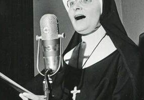 This photo, taken in 1983, depicts Sister Marie Brendan Harvey presenting a recital of Sacred Music.