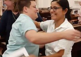 Sister Emily TeKolste (left) embraces Sister Stephanie Rivas.