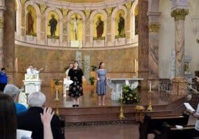 All those gathered for the Liturgy of Vows bless Sisters Arrianne and Tracey.