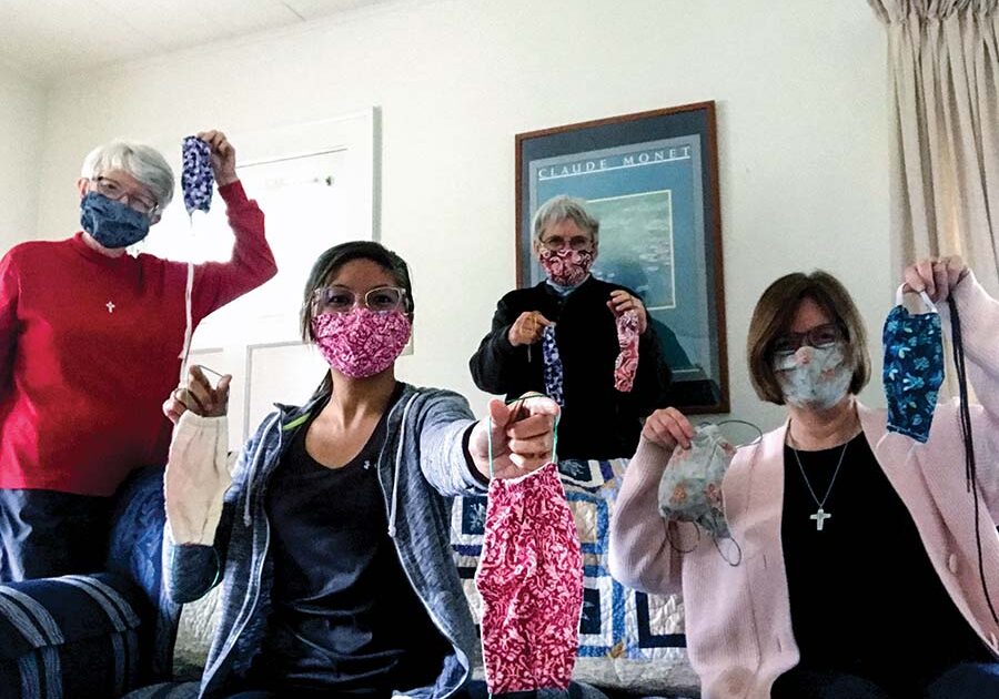 Sisters living in the formation house, from left, Sisters Marsha Speth, Jessica Vitente, Nancy Bartasavich and Janice Smith, show off the masks they have made. 