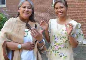 Sister Joni shows off her new ring and Sister Jessica her new cross, both symbols of the vows they have taken, after the ceremony.