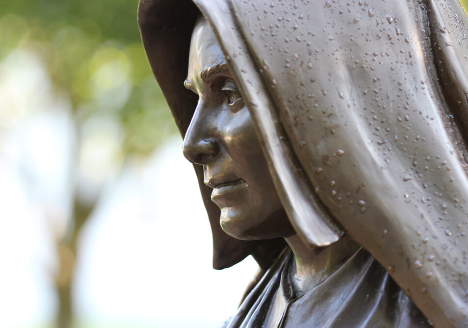 Saint Mother Theodore Guerin statue on a misty morning.